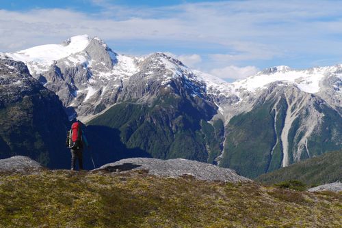 Student demonstrating great pack packing skills in a vast Patagonia mountain range