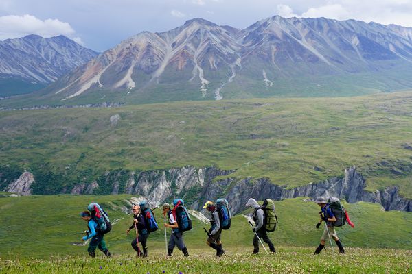 Students backpacking with one of their instructors through the rugged Alaskan landscape. 