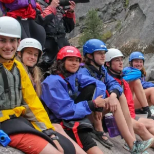 Six young kids posing with their rafting gear on for the Salmon River Adventure along the river