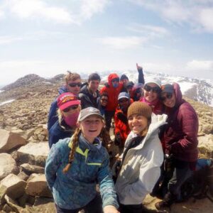 Students celebrate summiting a peak in the Wind River Range.