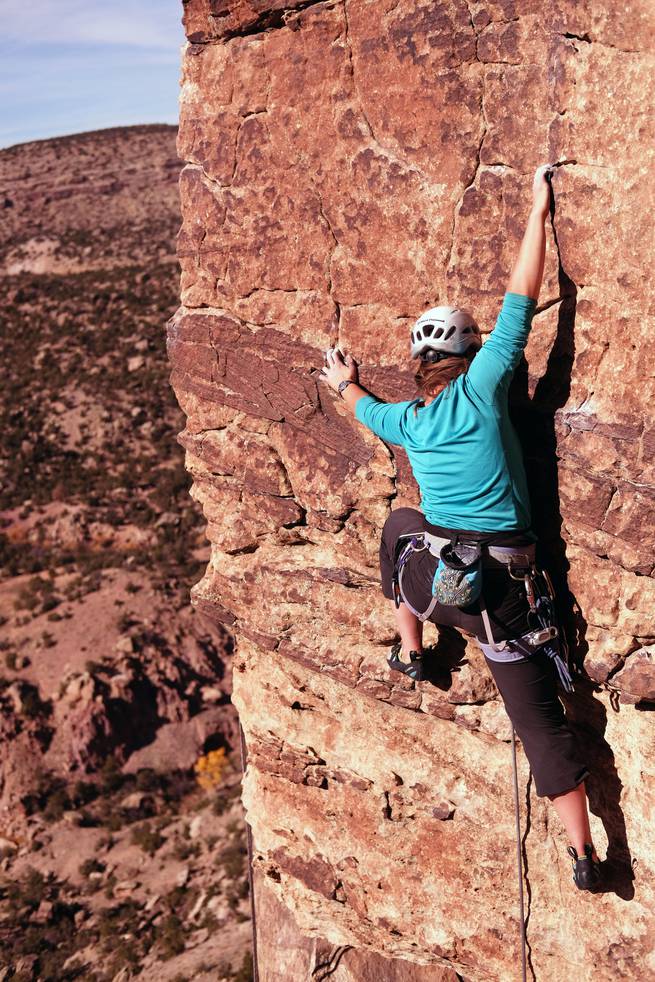 anthony_fox_rm-63-edit.jpg__655x5000_q70_subject_location-2000,3010_subsampling-2 Student free climbing a cliff face with chalked hands
