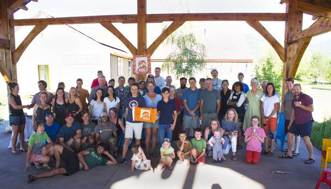 Alumni gathered at NOLS Teton Valley's outside pavilion for an event.