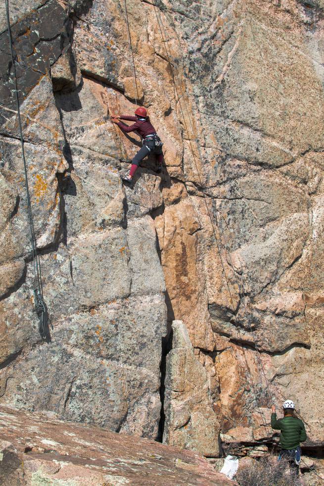 jonah-raether-rm-9-edit.jpg__655x5000_q70_subject_location-2000,3000_subsampling-2 One student climbing a cliff face, while another is belaying.