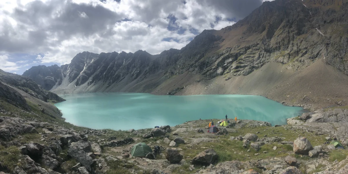 A turquoise lake nestled between rocky mountains