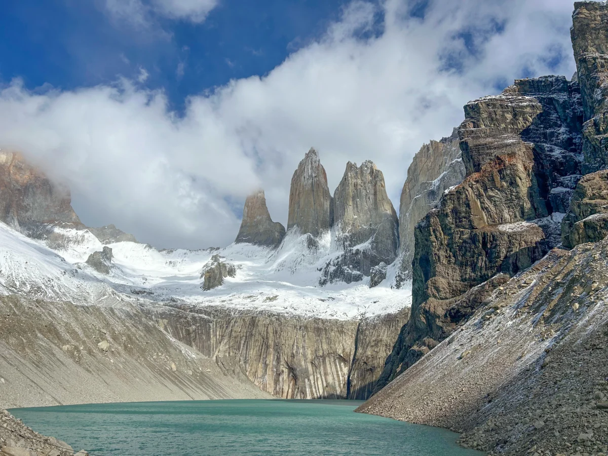 The famous Towers of Torres del Paine National Park with snow and sun shining, casting shadows