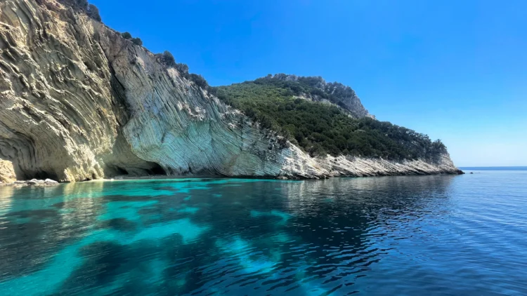 Blue water and white cliffs