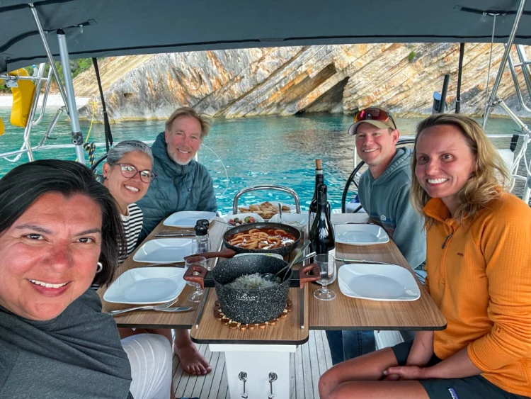 Sailors eat a meal aboard the boat
