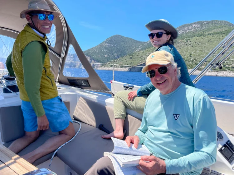 Sailors smile on the boat