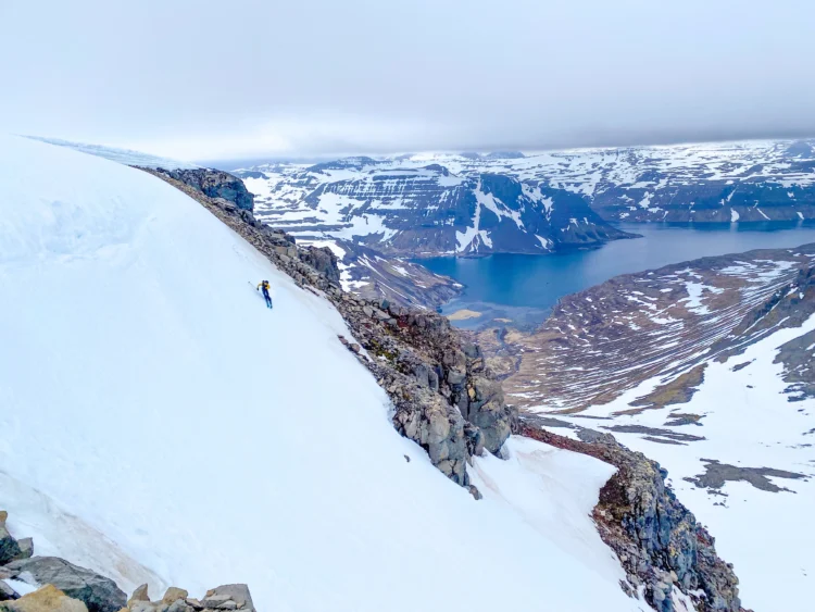 Skier skies down steep slope in Iceland