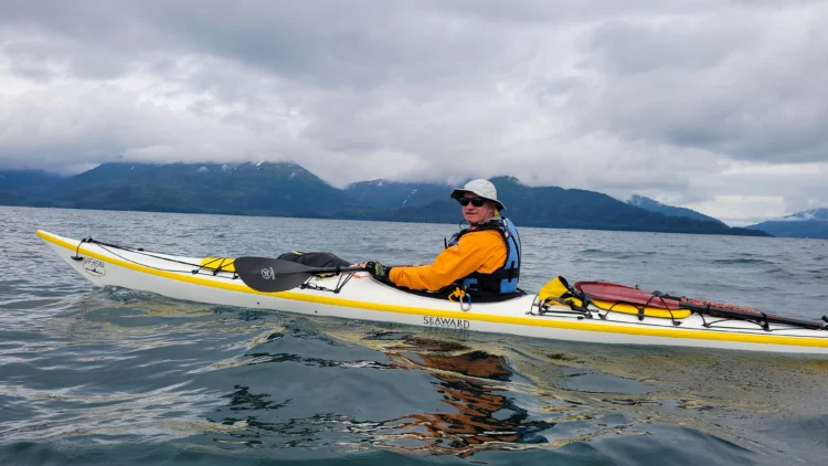 Kayaker paddles his boat in Prince William Sound