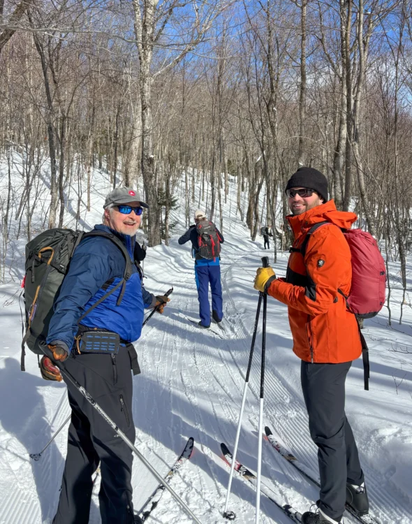 Skiers take a break on the trail in Maine