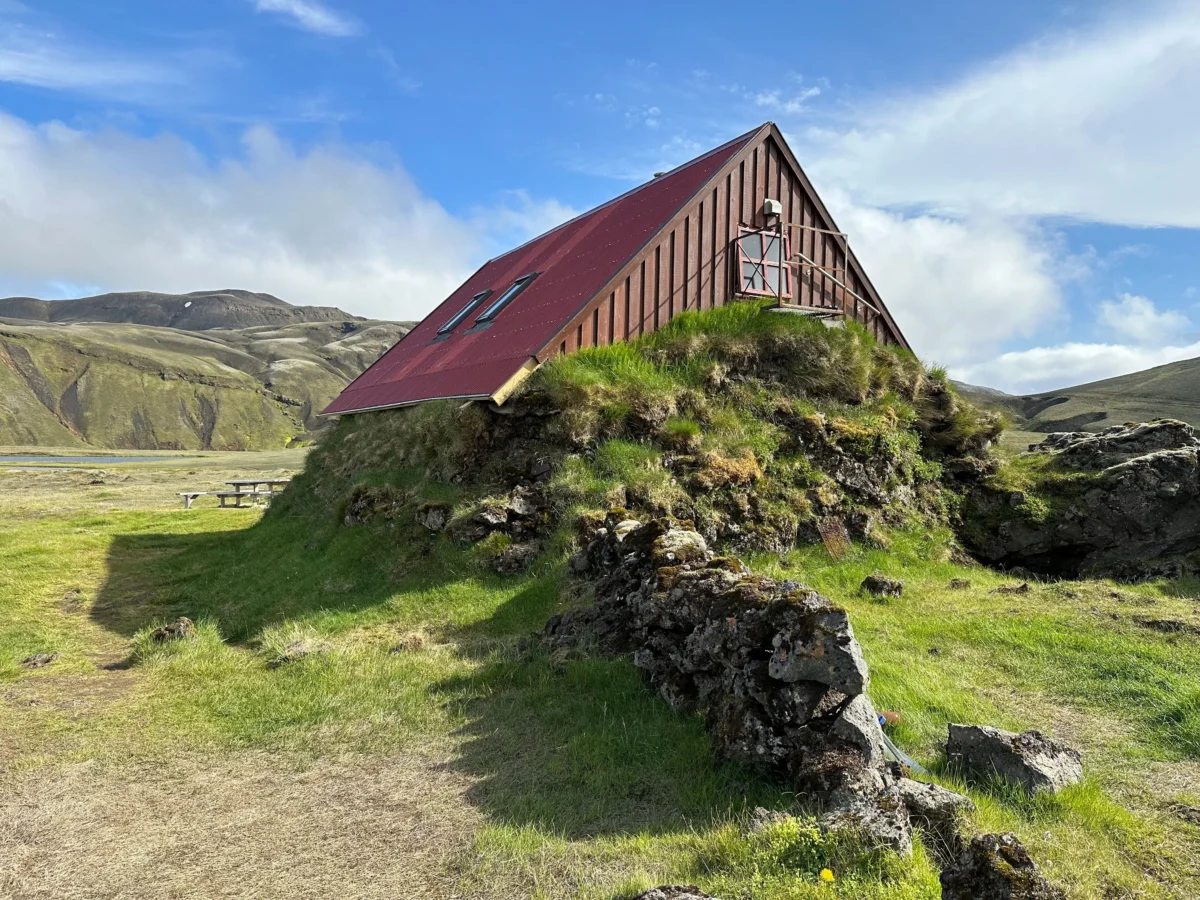 Hut with grass growing up the side of it in Iceland