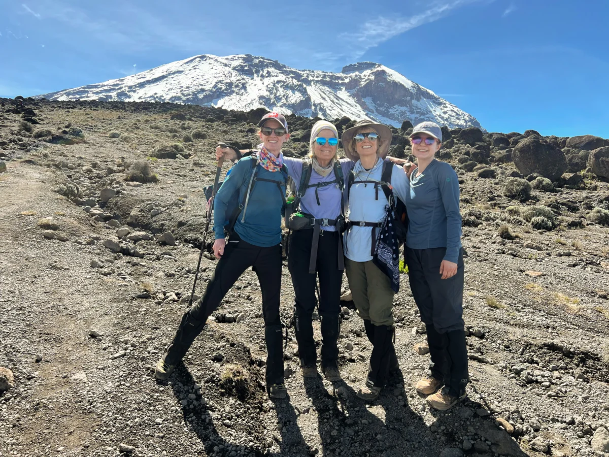 Hikers smile hiking up Kilimanjaro